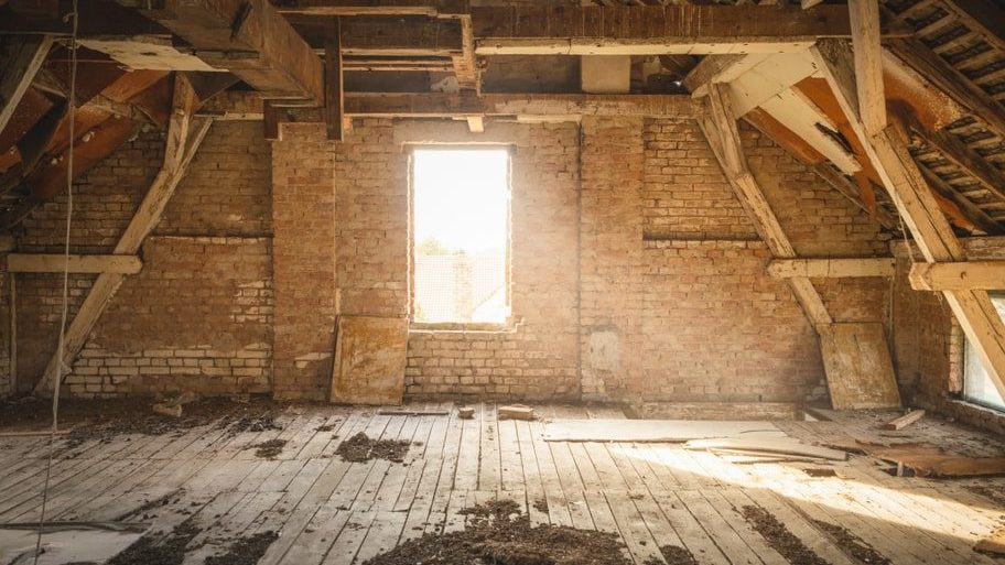 An Empty Attic After Cle0an Out Services by PowerHouse Dumpsters & Junk Removal